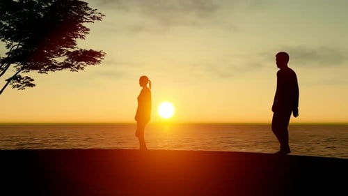 Couple Silhouettes Walking at Sunset Over Ocean