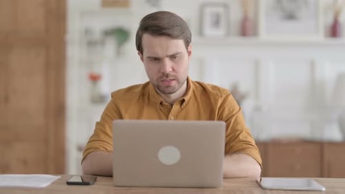 Man Working At Laptop, Frustrated