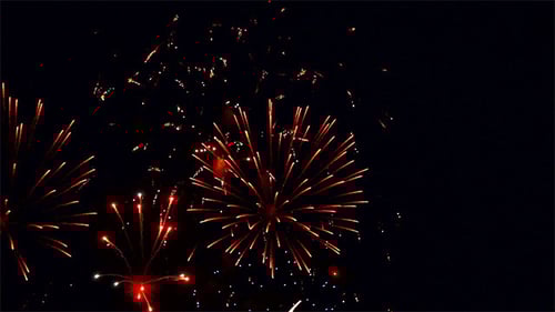 Vibrant Fireworks Exploding at Night
