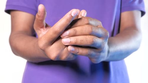 Man Suffering Pain in Finger Isolated on White Close Up