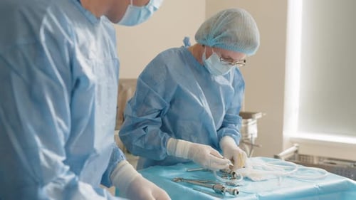Close Up of Hands Group of Surgeons at Work
