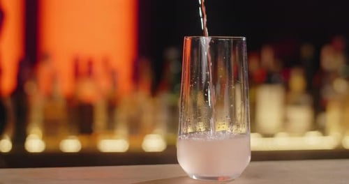Beverage Being Poured in Glass at Bar