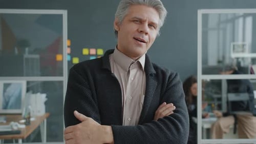 Confident Businessman in Modern Office Environment