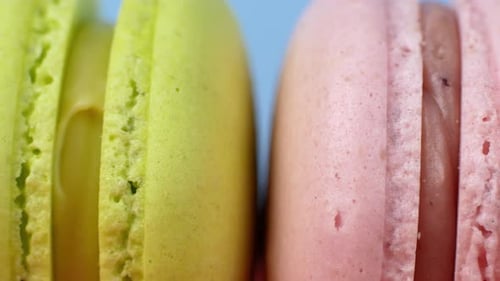 Macro shot Multicolor Macarons, French macaroon, sweet tasty desserts.