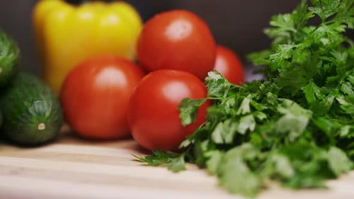 A Side View of Fresh Vegetables on a Wooden Cutting Board