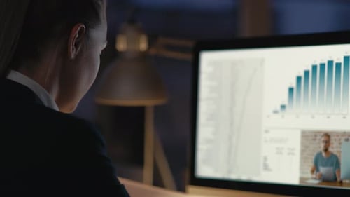 Caucasian adult woman has video conference at the office. Shot with RED helium camera in 8K.