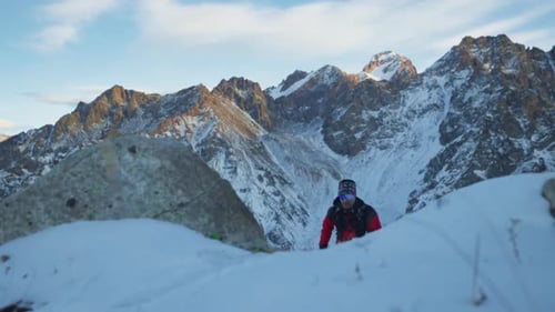 Man Running at the Mountain with Snow