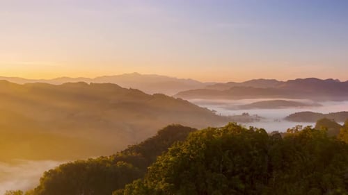 Sunrise Over Misty Mountain Range