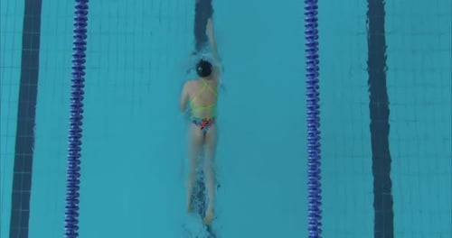 Woman Swims Along the Water Track in the Pool Modern Fitness