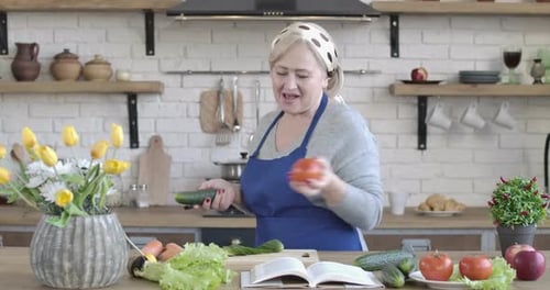 Woman Prepares Fresh Vegetables in Kitchen
