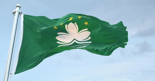 Realistic Macau Flag Waving on Flagpole Against Blue Sky