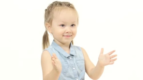Happy Child Clapping in Studio