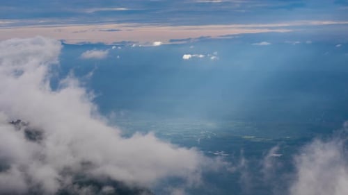 Scenic Aerial of Cloud-Shrouded Mountains and Valley