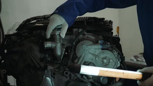 Mechanic with Wrench Working and Repair Car Engine in Car Service Centre Man Handsome Portrait