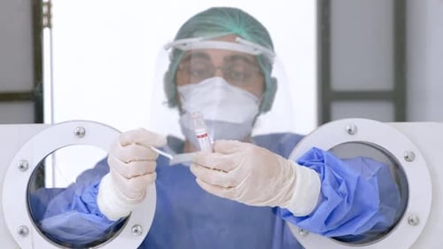Healthcare Worker Performs Medical Test in Sterile Environment