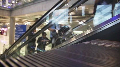 Modern Escalators in Busy Airport Terminal