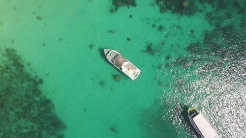 Cinematic Aerial Circling Shot Over Boats in the Green Lagoon on Summer Day.