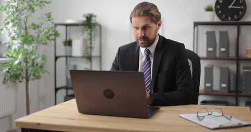 Man Having Video Chat on Laptop