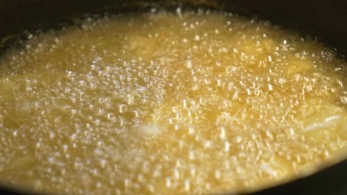 close up on frying oil. cooking, food, flavors