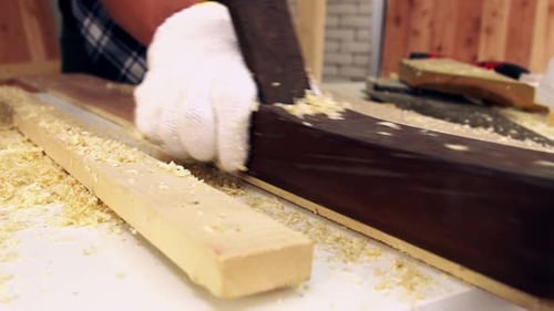 Carpenter Working on Wood Craft at Workshop