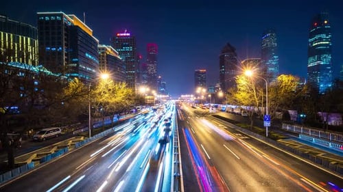 Timelapse of busy traffic road with modern office building in beijing china