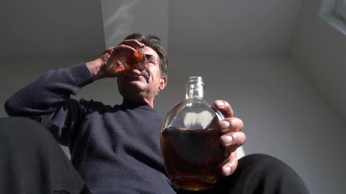 Middle Aged Man Drinking Alcohol
