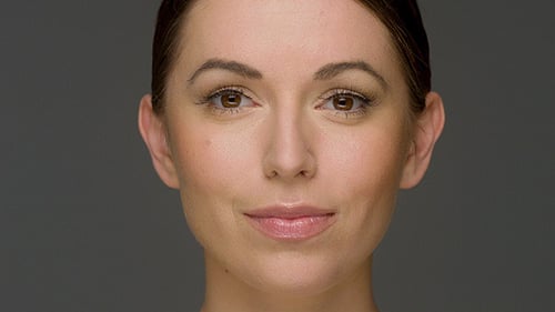 Smiling Woman Close-Up on Gray Background