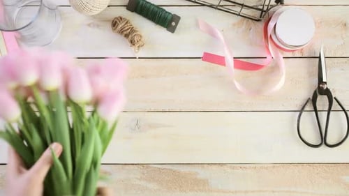 Arranging a Beautiful Bouquet of Pink Tulips
