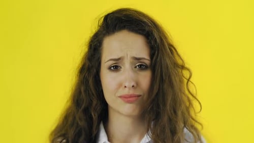 Sad Young Woman Looking at Camera