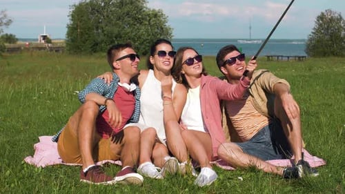 Friends Taking Picture By Selfie Stick in Summer 31