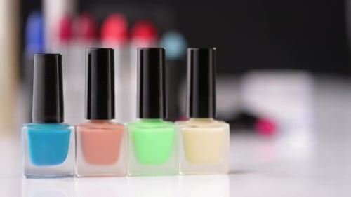 Pastel Nail Polish Bottles in a Row