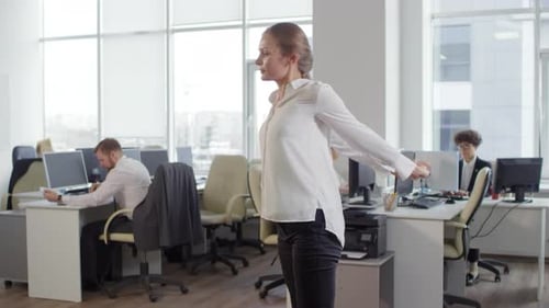 Office Worker Stretching During a Break at Work