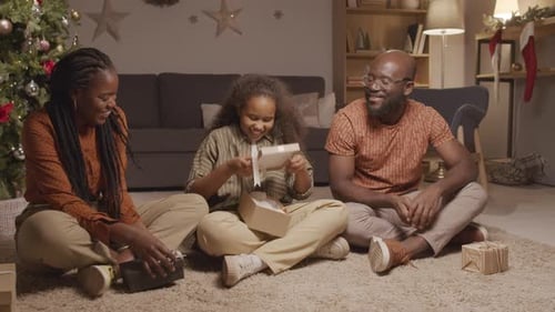 Happy Family Opening Christmas Presents