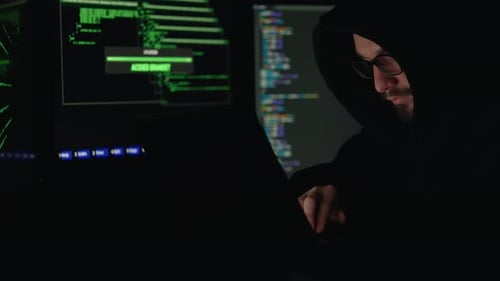 Hooded Coder Works at Night