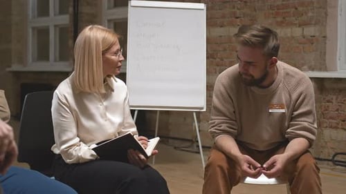 Therapy Session with Woman Speaking to Man