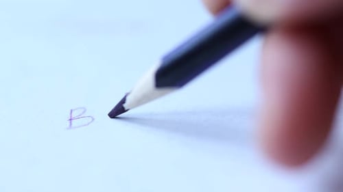 Closeup View of Handwriting Word Back to with Dark Blue Pencil