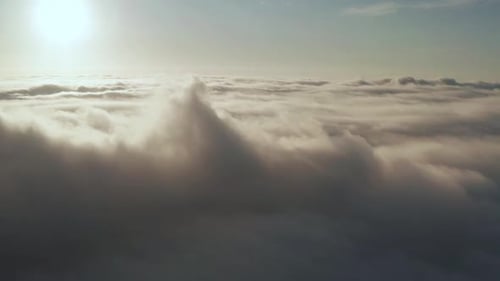 Aerial Flight Over Ethereal White Clouds