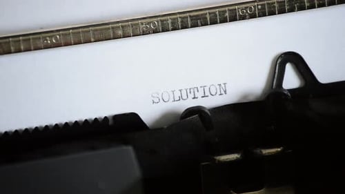 Typing the Word Solution on a Vintage Typewriter