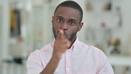 Scolding Man Points Finger at Camera Close Up