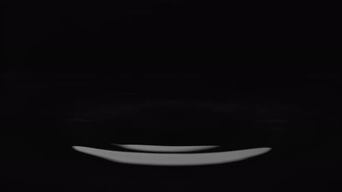 Water Droplets Splashing on Dark Surface