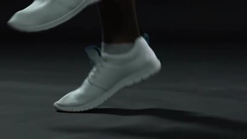 Person Jogging in Place Wearing White Sneakers