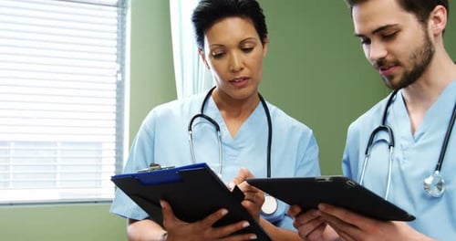 Medical Professionals Reviewing Patient Data in Hospital