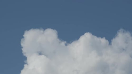 White Clouds Drifting Across a Blue Sky