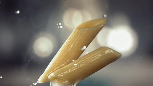 Fresh Penne Pasta Falling in Slow Motion