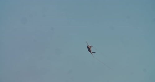 Jet Plane Flying Across Clear Blue Sky