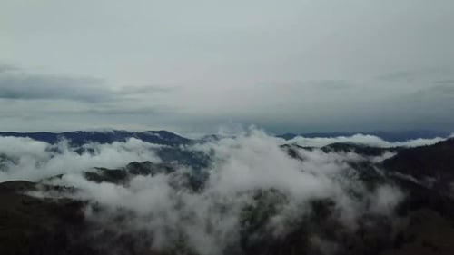 Fog and Clouds Rolling Over Green Hills