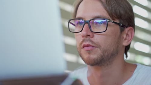 Man Works at Computer in Office, Close Up