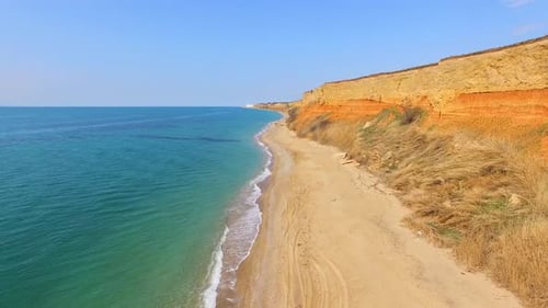 Camera is moving along the rocky seashore. bird's eye view.