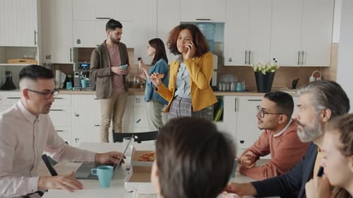 Diverse Team Meeting at Modern Workplace Kitchen