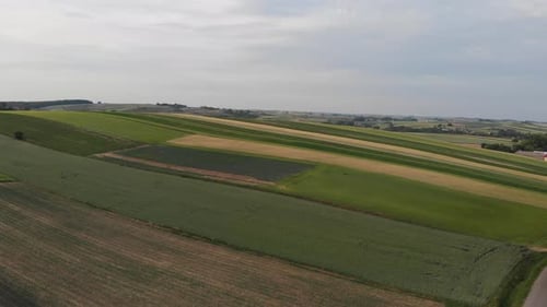 Aerial footage with flight over agricultural field.